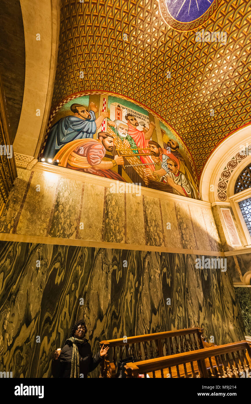 England, London, Victoria, Westminster Cathedral, The Chapel of St Joseph, Woman Praying and Mosaic of Joseph the Carpenter Building Westminster Cathe Stock Photo