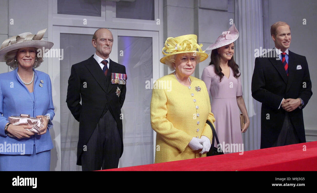 Wax figures of (left to right) the Duchess of Cornwall, the Duke of Edinburgh, Queen Elizabeth II, the Duchess of Cambridge and the Duke of Cambridge standing on a newly-unveiled set recreating the Buckingham Palace balcony at Madame Tussauds in London. Visitors to the attraction will be able to step on to the balcony and pose with the royal family. Stock Photo