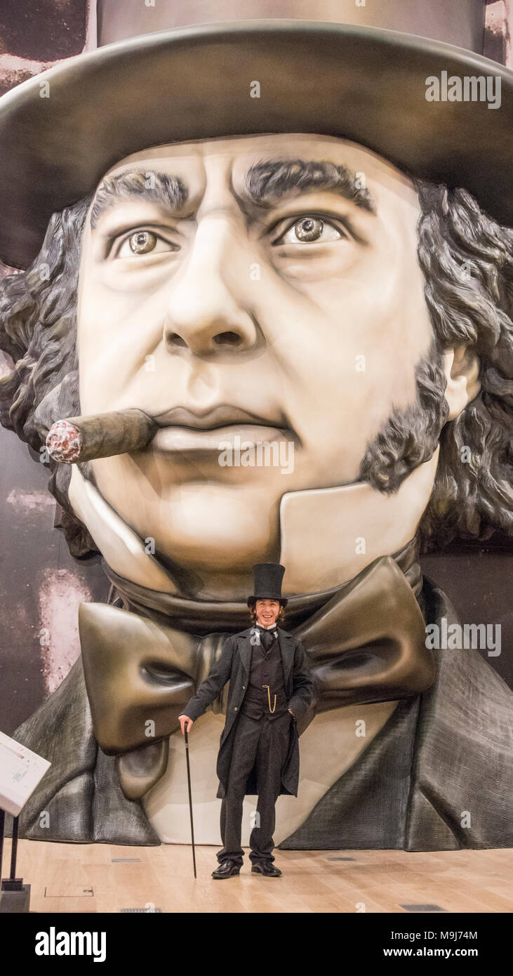 An actor posing as Brunel stands in front of a giant 3D depiction of the great man at the newly opened Being Brunel museum, Bristol Stock Photo