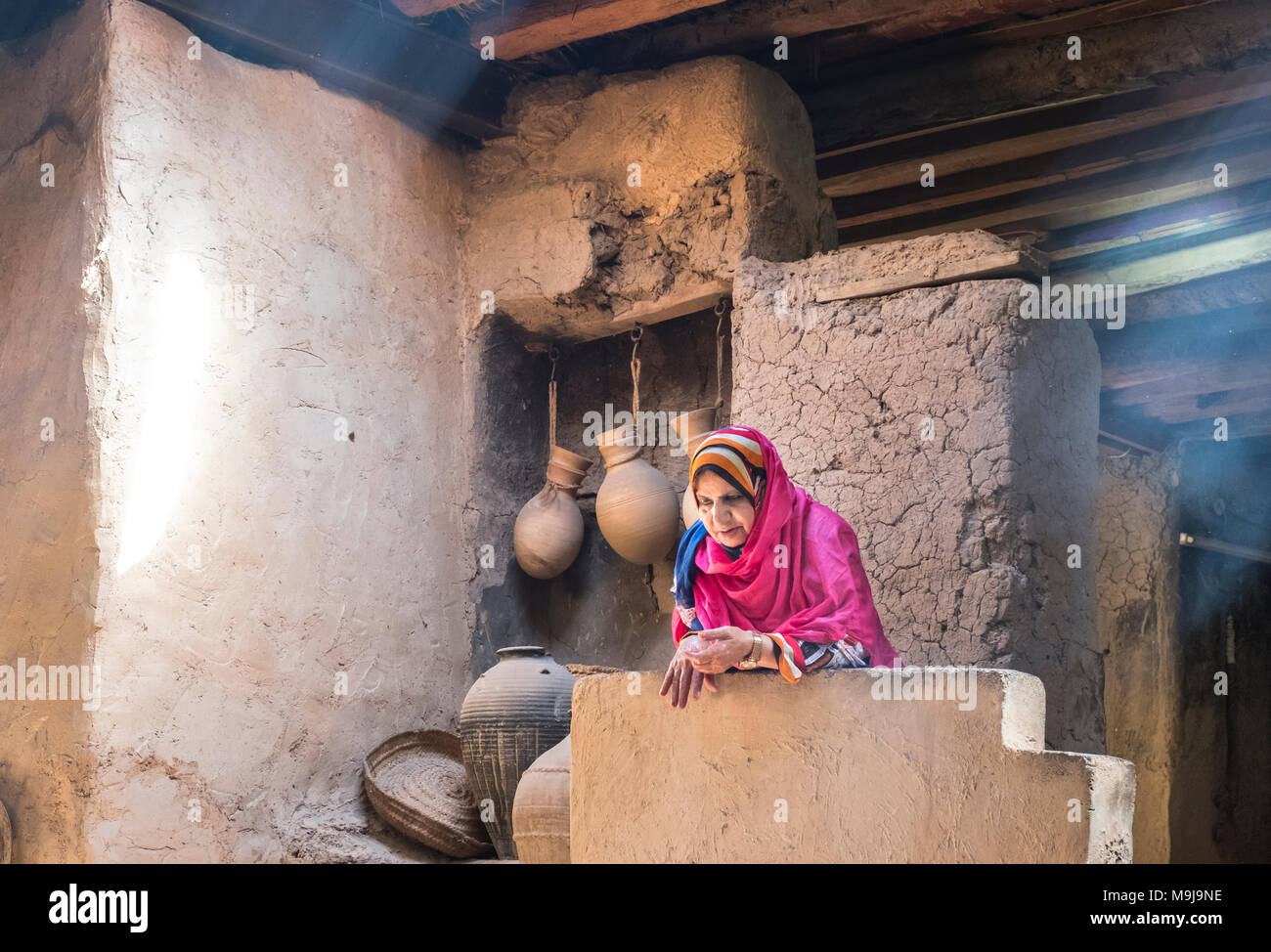 AL Hamra, Oman, March, 24th, 2018: omani woman in traditional kitchen Stock Photo - Alamy