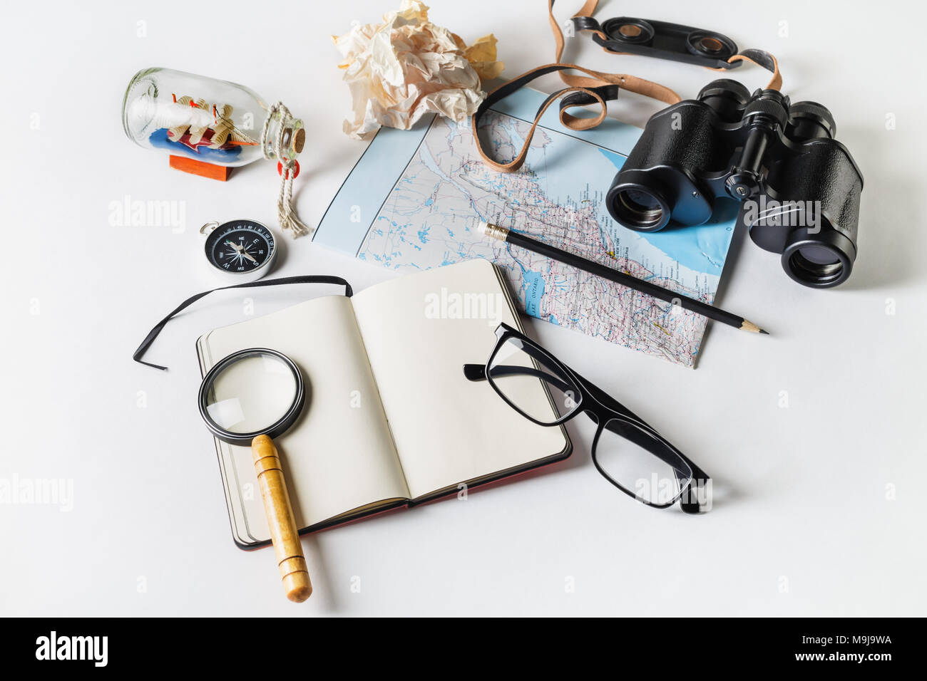 Still Life Map Travel and tourism still life. Map, binoculars, compass, notepad ...