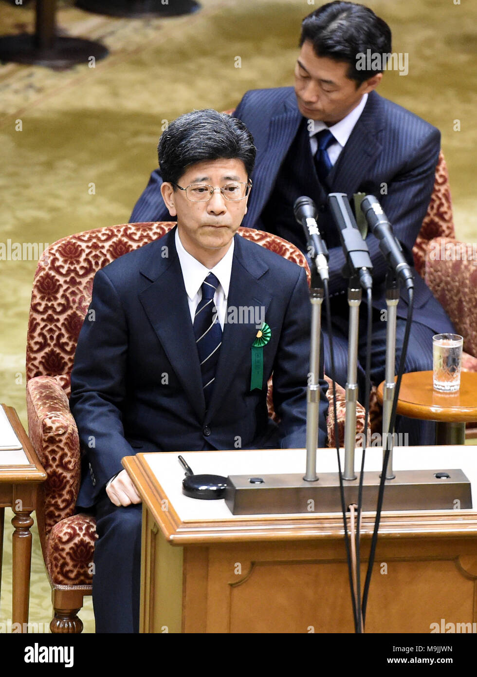 (180327) -- TOKYO, March 27, 2018 (Xinhua) -- Former head of the National Tax Agency Nobuhisa Sagawa (front) appears as a sworn witness in the Diet, Japan's bicameral legislature, in Tokyo, Japan, March 27, 2018. A key figure in a document-tampering scandal involving Japan's Finance Ministry appeared in the Diet on Tuesday to give sworn testimony over the falsification of government documents related to the heavily discounted sale of state land to a nationalist school operator. Former national tax agency head Nobuhisa Sagawa, who was previously in charge of taking care of the land sale, steppe Stock Photo