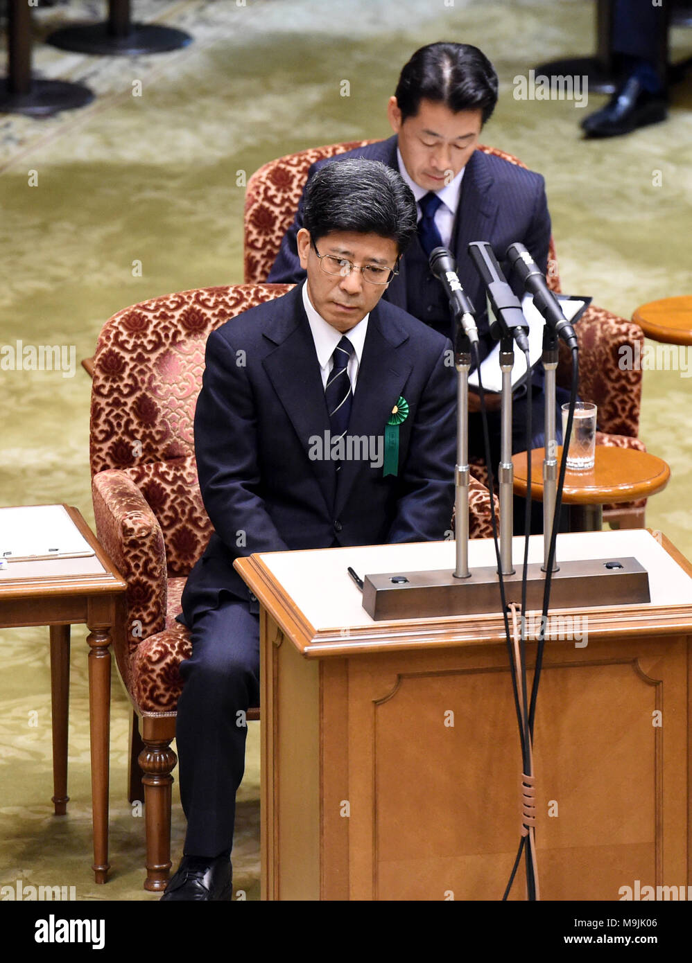 (180327) -- TOKYO, March 27, 2018 (Xinhua) -- Former head of the National Tax Agency Nobuhisa Sagawa (front) appears as a sworn witness in the Diet, Japan's bicameral legislature, in Tokyo, Japan, March 27, 2018. A key figure in a document-tampering scandal involving Japan's Finance Ministry appeared in the Diet on Tuesday to give sworn testimony over the falsification of government documents related to the heavily discounted sale of state land to a nationalist school operator. Former national tax agency head Nobuhisa Sagawa, who was previously in charge of taking care of the land sale, steppe Stock Photo