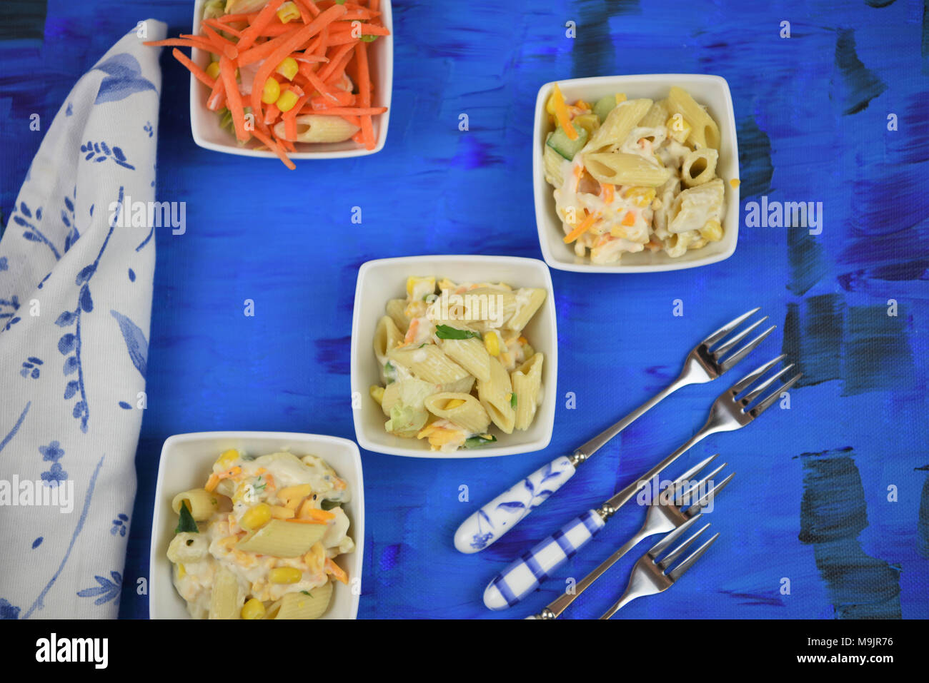 flat lay with dishes of pasta salad Stock Photo