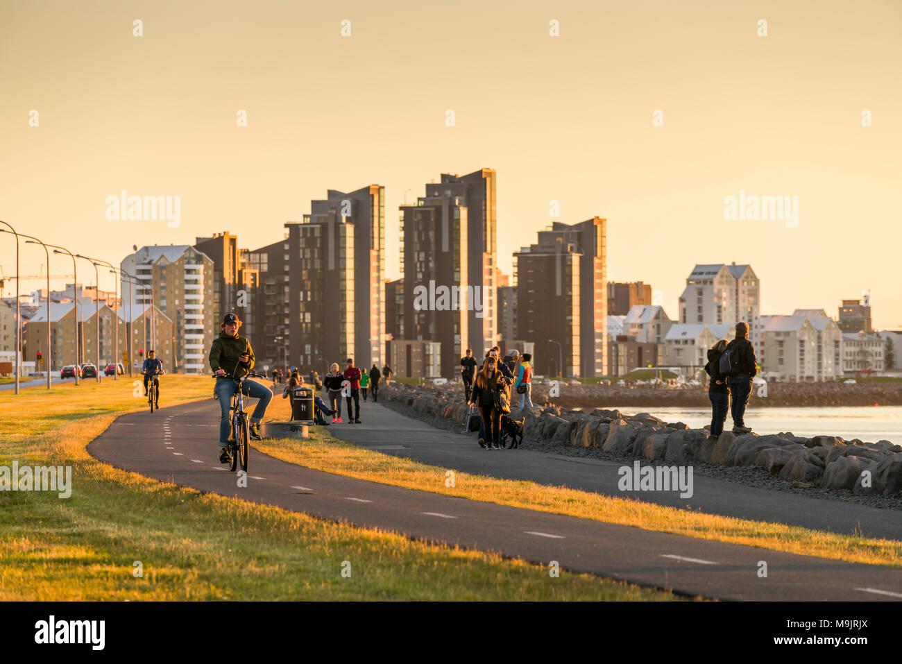 People strolling by the sea, Saebraut, Reykjavik, Iceland Stock Photo