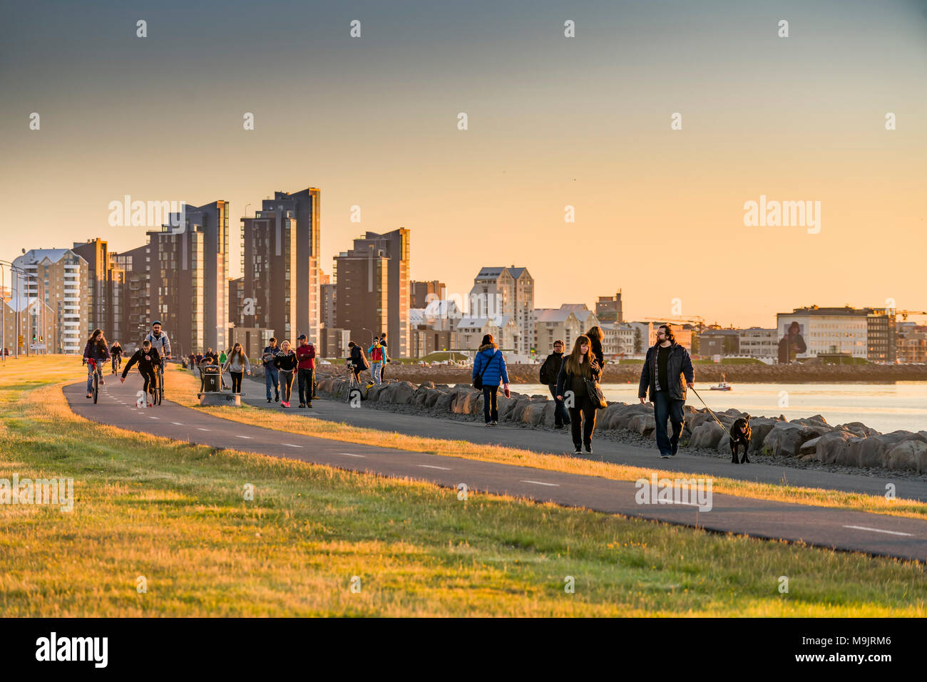 People strolling by the sea, Saebraut, Reykjavik, Iceland Stock Photo