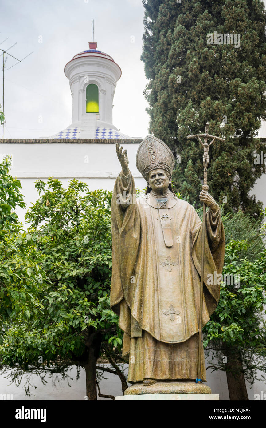 Plaza Virgen de los Reyes - the bronze statue of Pope John Paul II in the centre of the Spanish city of Seville, Andalusia, Spain Stock Photo