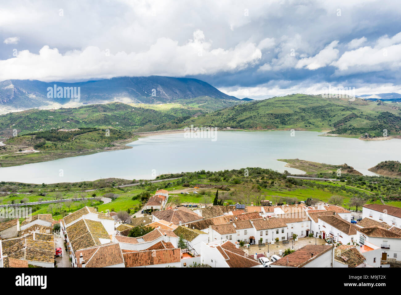 Scenic views over the village of Zahara de la Sierra to the Zahara-El Gastor Reservoir (Embalse de Zahara), an artificial lake in Andalusia, Spain Stock Photo