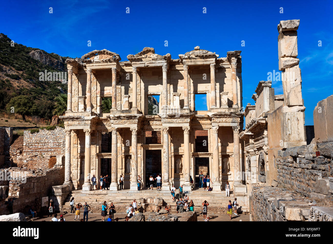 Ancient Library of Celsus walls in Efes, site full of tourists. Wide front view. EPHESUS, TURKEY - SEPTEMBER 30, 2014 Stock Photo