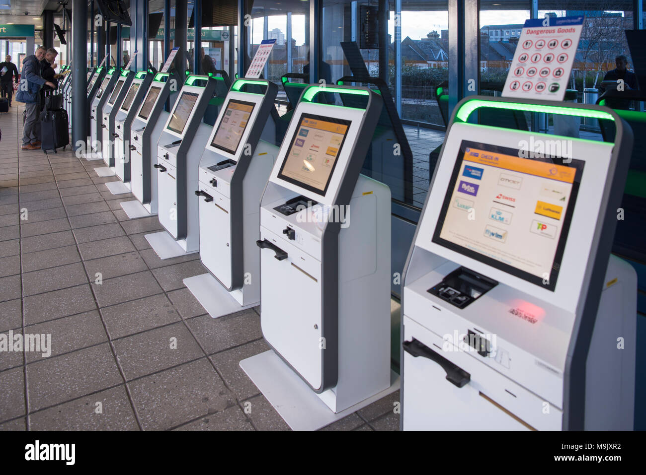 Self-service airline check-in desk boarding pass printers at London City Airport, England, United Kingdom Stock Photo