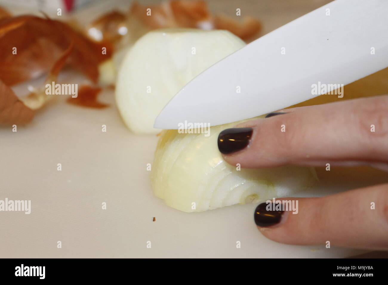 female hands cutting sliced onion Stock Photo - Alamy