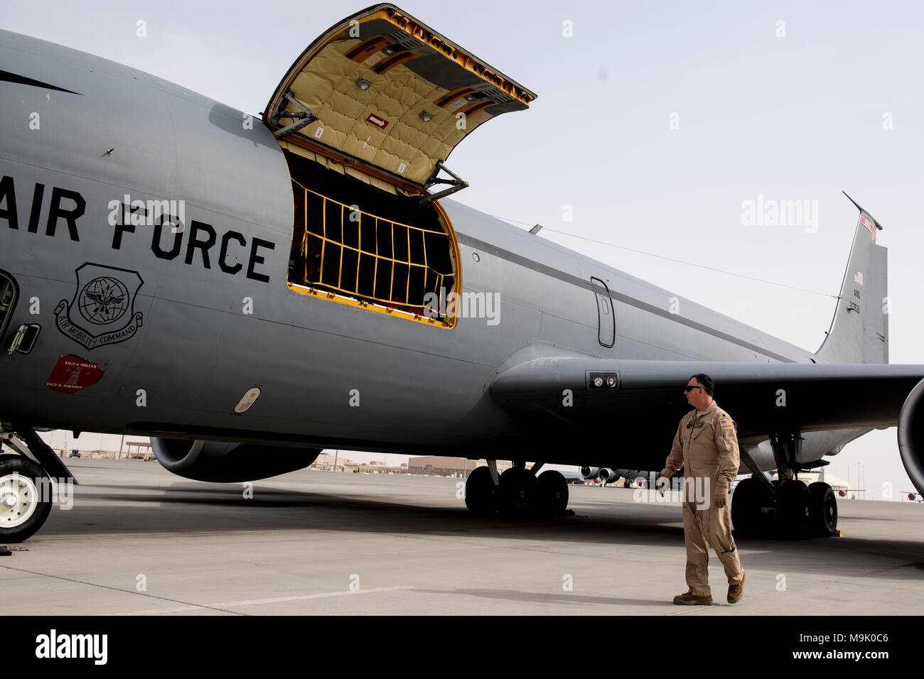 A U.S. Air Force KC-135 Stratotanker pilot assigned to the 340th Expeditionary Air Refueling Squadron conducts a walk-around inspection on his aircraft on Al Udeid Air Base, Qatar, March 16, 2018. The 340th EARS is assigned to the 379th Expeditionary Operations Group and supports various operations in countries such as Iraq, Syria and Afghanistan. (U.S. Air Force Photo by Tech. Sgt. Paul Labbe) Stock Photo