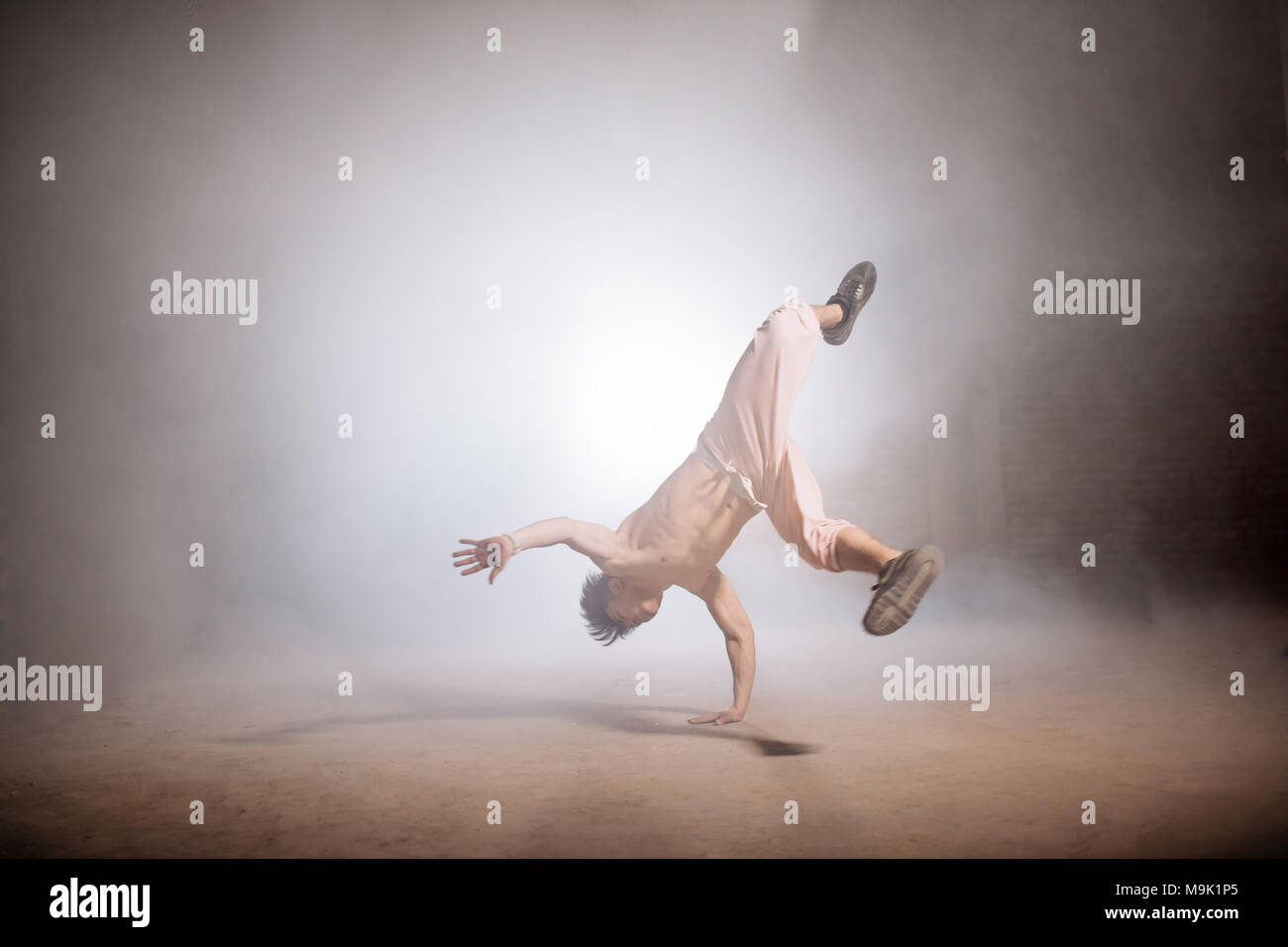 Slim Man Standing On One Hand While His Body In The Air Perfect Technique Slim Man Standing On One Hand While His Body In The Air Perfect Technique