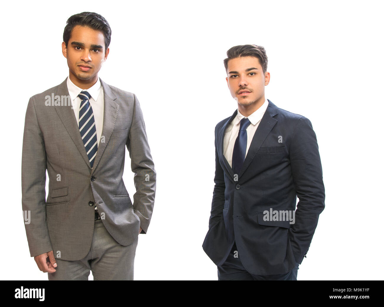 two young business man in suits in white background Stock Photo - Alamy