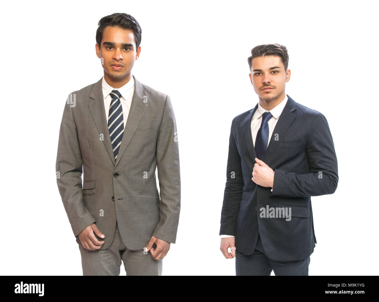 two young business man in suits in white background Stock Photo - Alamy