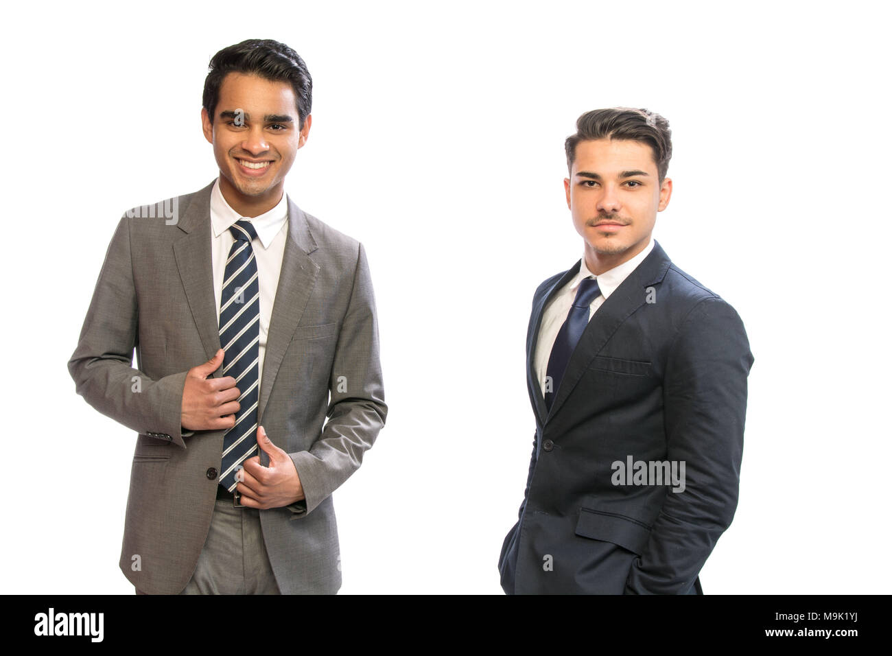 two young business man in suits in white background Stock Photo - Alamy