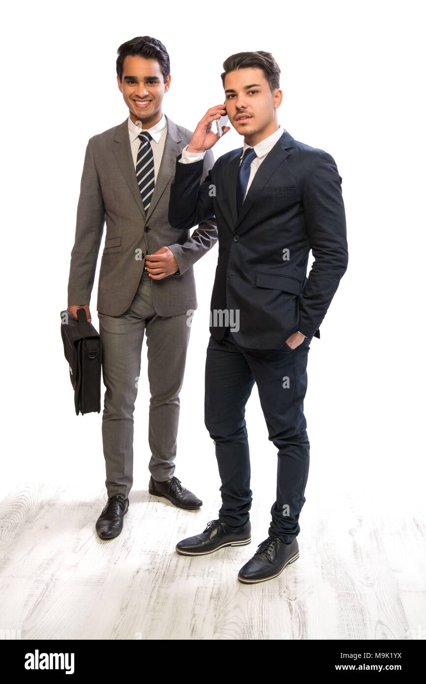 two young business man in suits in white background Stock Photo - Alamy