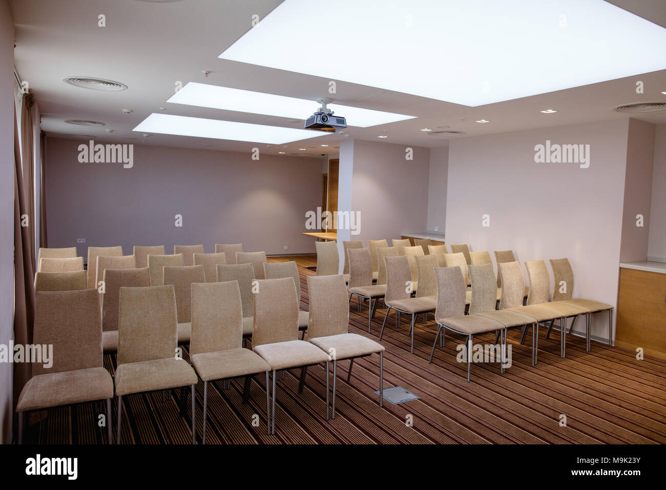 Light Bright Conference Room With Blue Walls And Chairs On