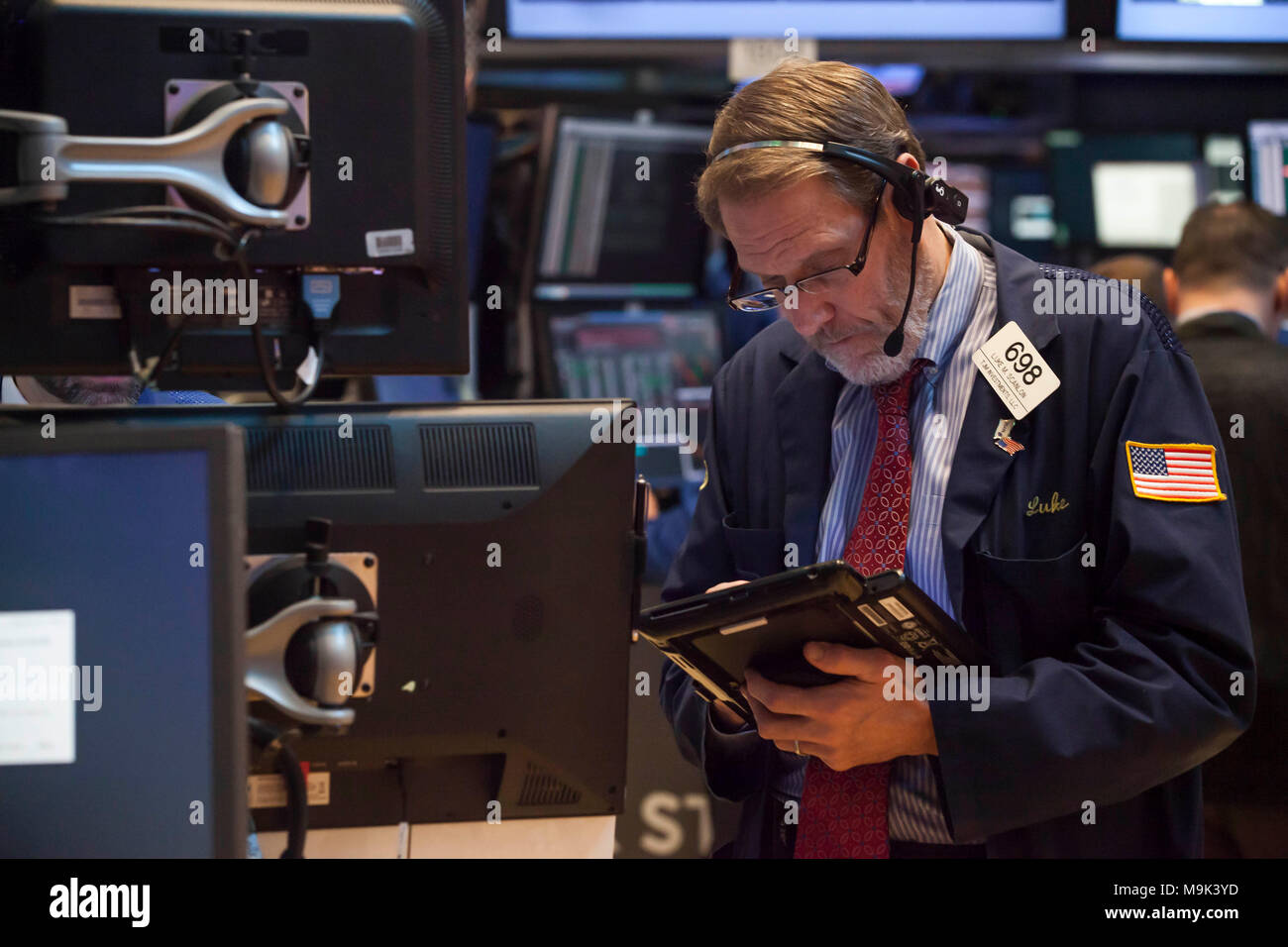 A trader working on a trade on the New York Stock Exchange ...
