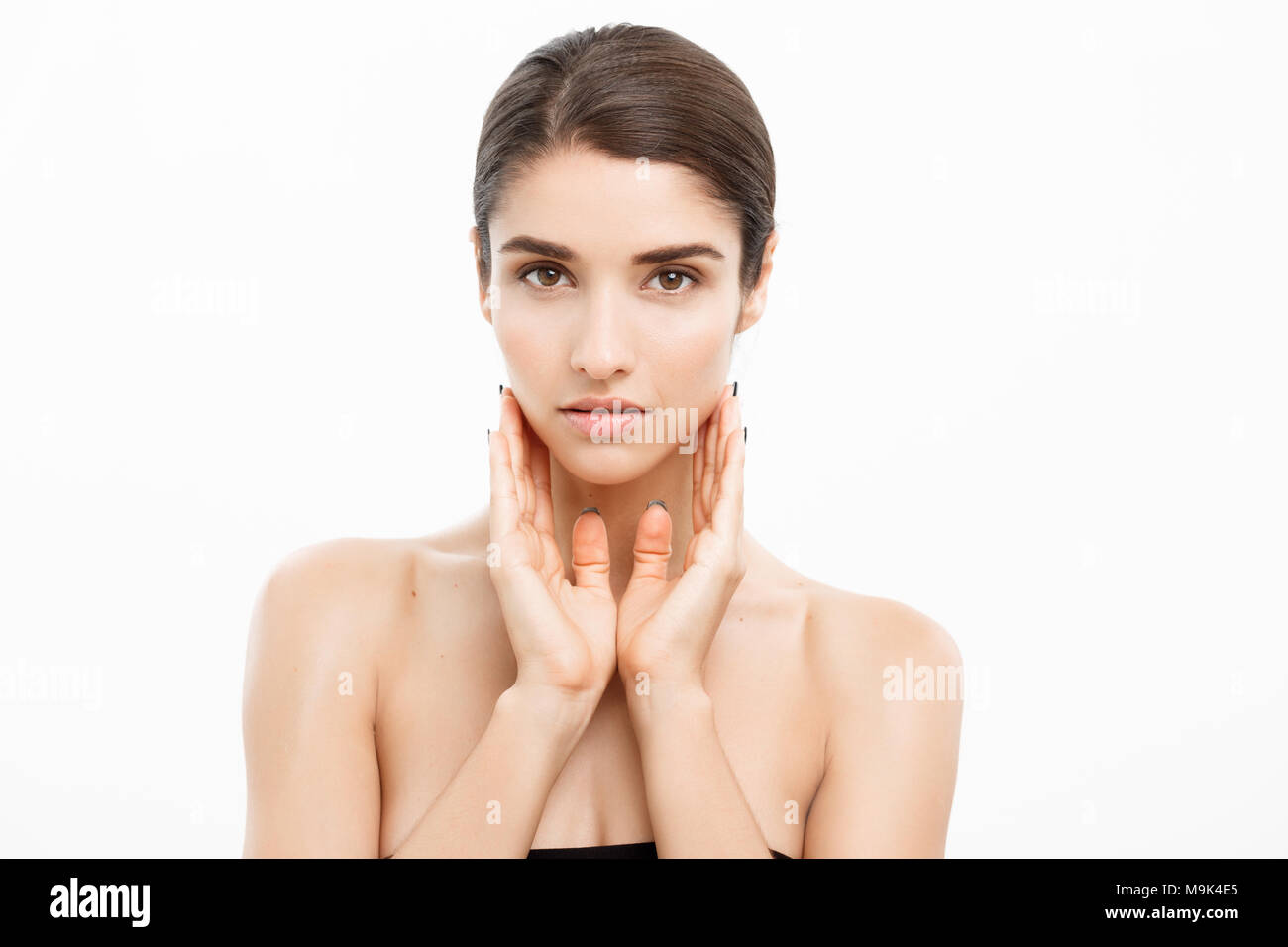 Beauty and Skin care concept - Close up Beautiful Young Woman touching ...