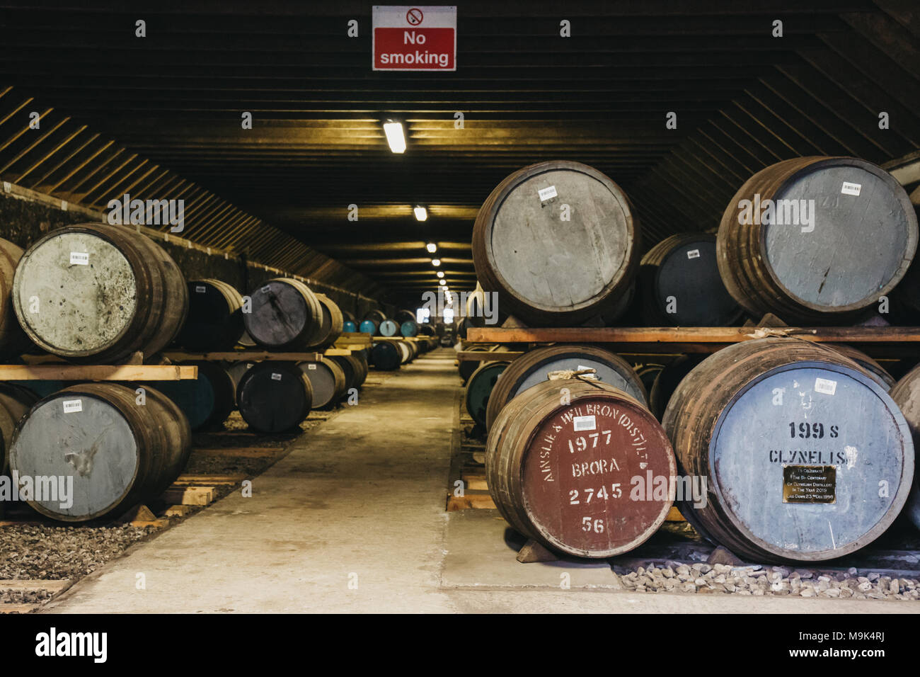 Barrels of whisky inside Brora Distillery warehouse in Scotland, rare Brora whisky in the front. Stock Photo