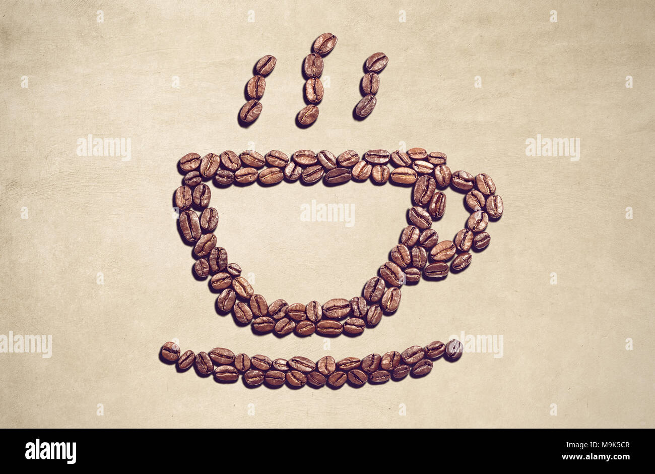 Coffee cup symbol made out of coffee beans Stock Photo