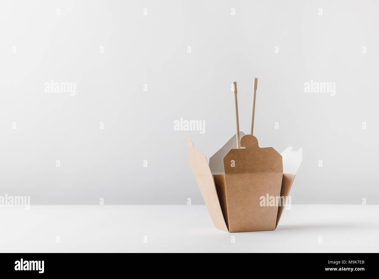 noodles box with chopsticks on white tabletop Stock Photo Alamy