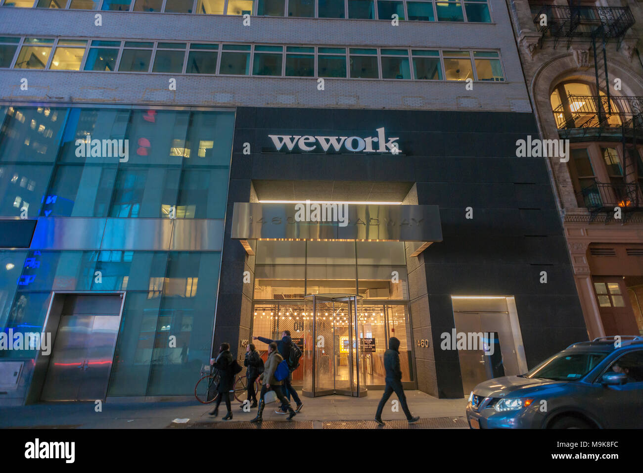 A sign announces the location of a a WeWork coworking space location