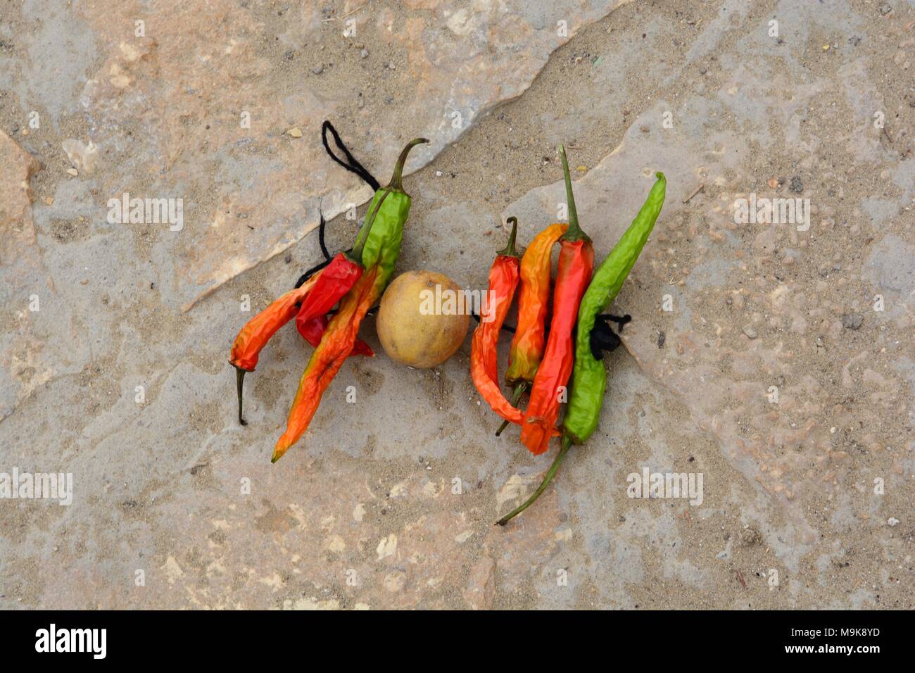 Seven chillies and a lime left on the street on Saturdays to ward off the evil eye Jaisalmer Rajashan India Stock Photo