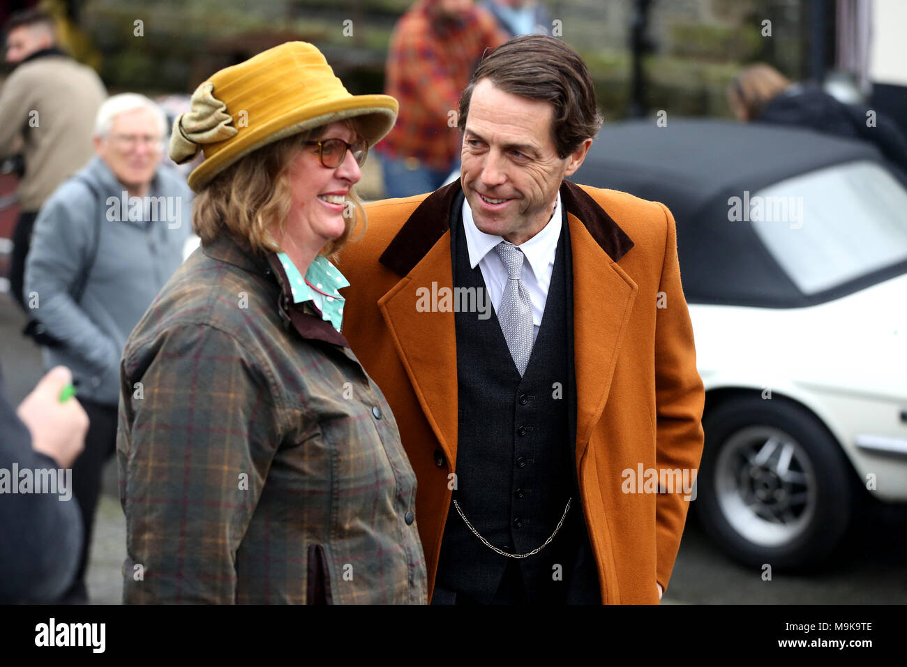 Hugh Grant filming 'A Very English Scandal' based on the life of the politician Jeremy Thorpe MP. Filming took place in the quaint Devon village of Ch Stock Photo