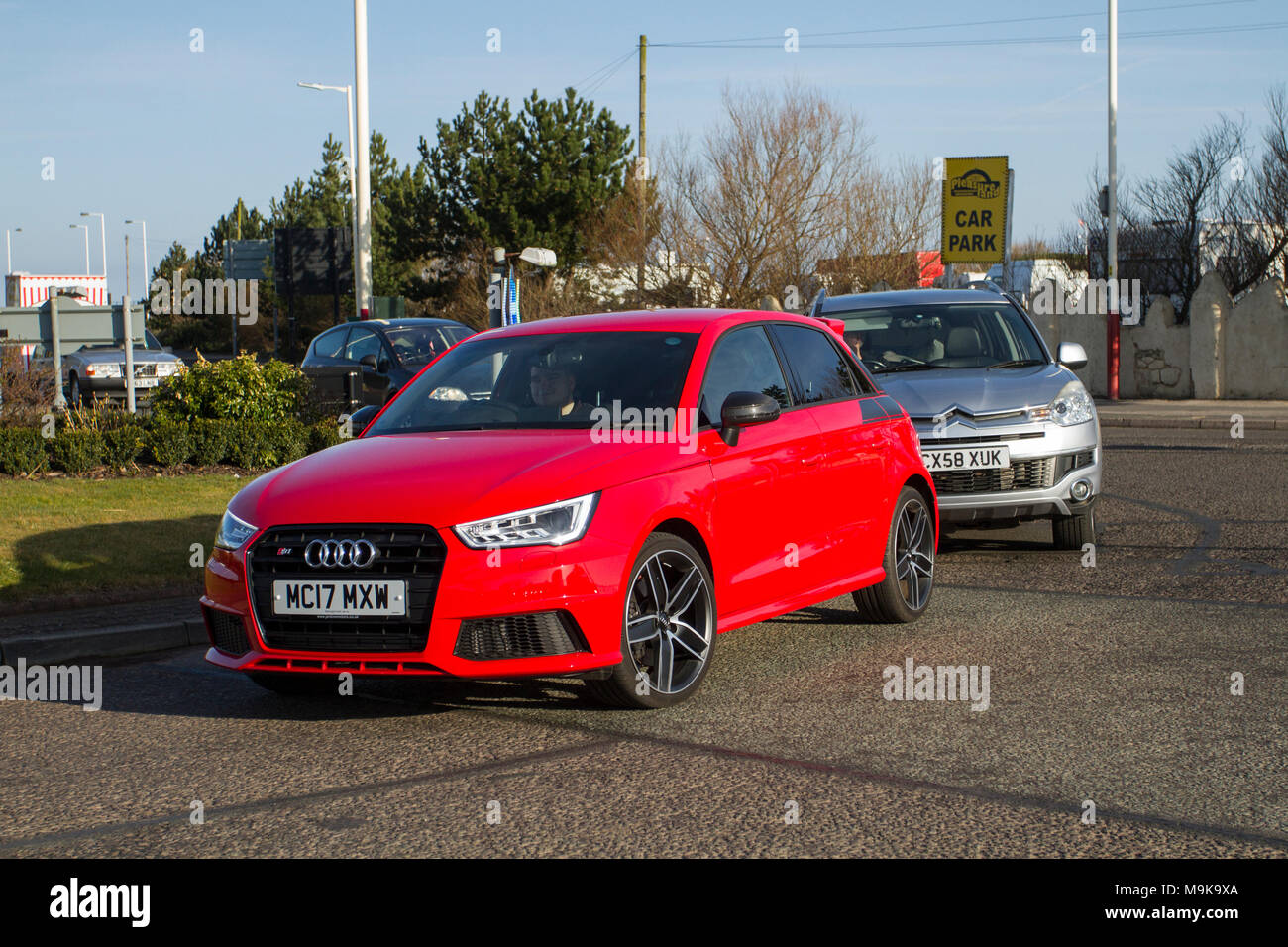 2017 red Audi S1 Competition Quattro; North-West Supercar event as cars arrive in the coastal resort of Southport. SuperCars are bumper to bumper on the seafront esplanade as modern classics, sports cars & vintage car enthusiasts enjoy a motoring day out. Stock Photo