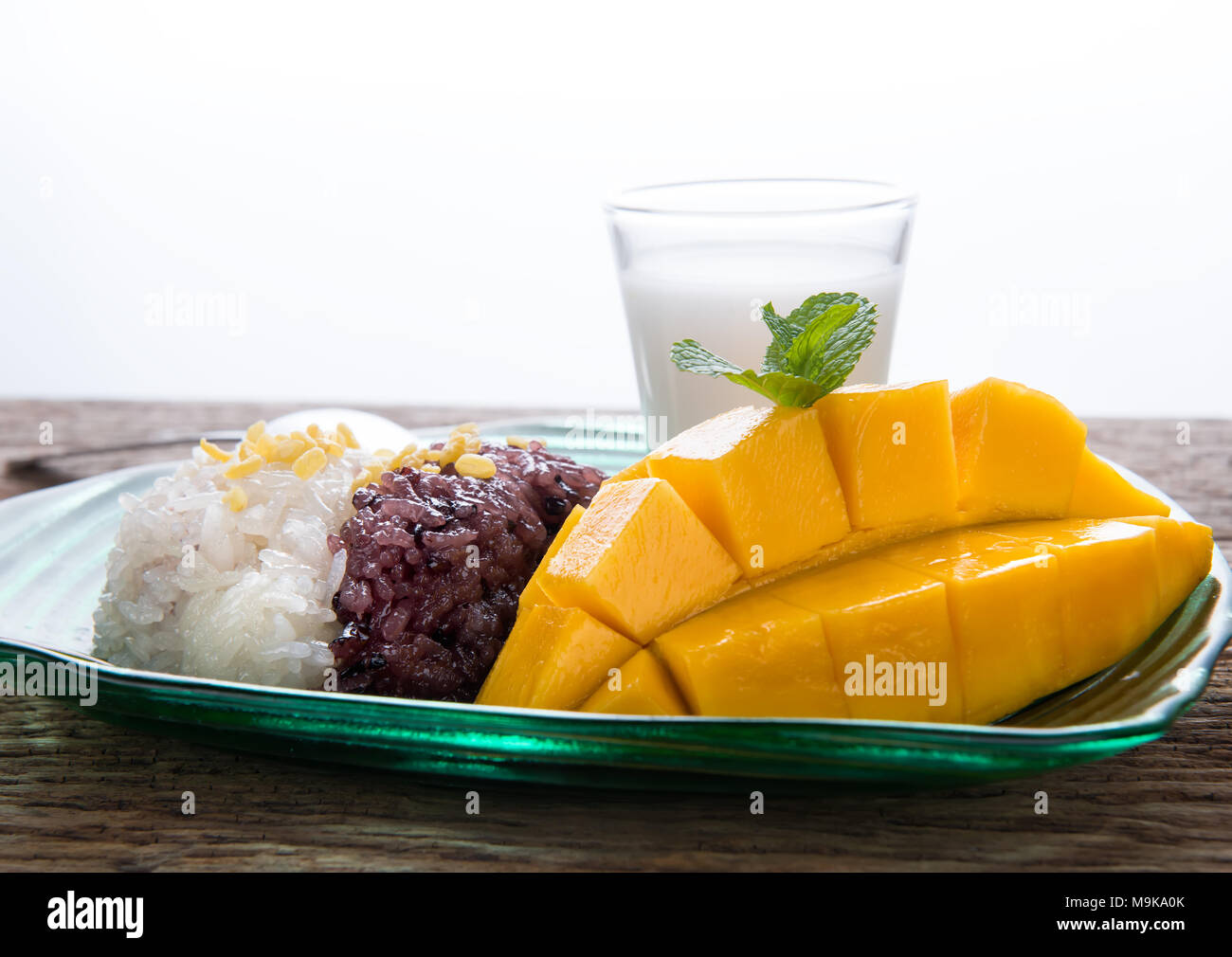 Mango with sticky rice in Thai style dessert of summer time ready to eat . Stock Photo