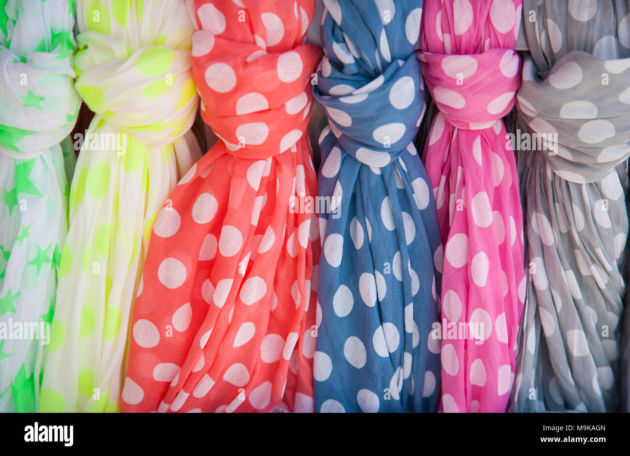 Many colorful dotted cotton summer scarves Stock Photo