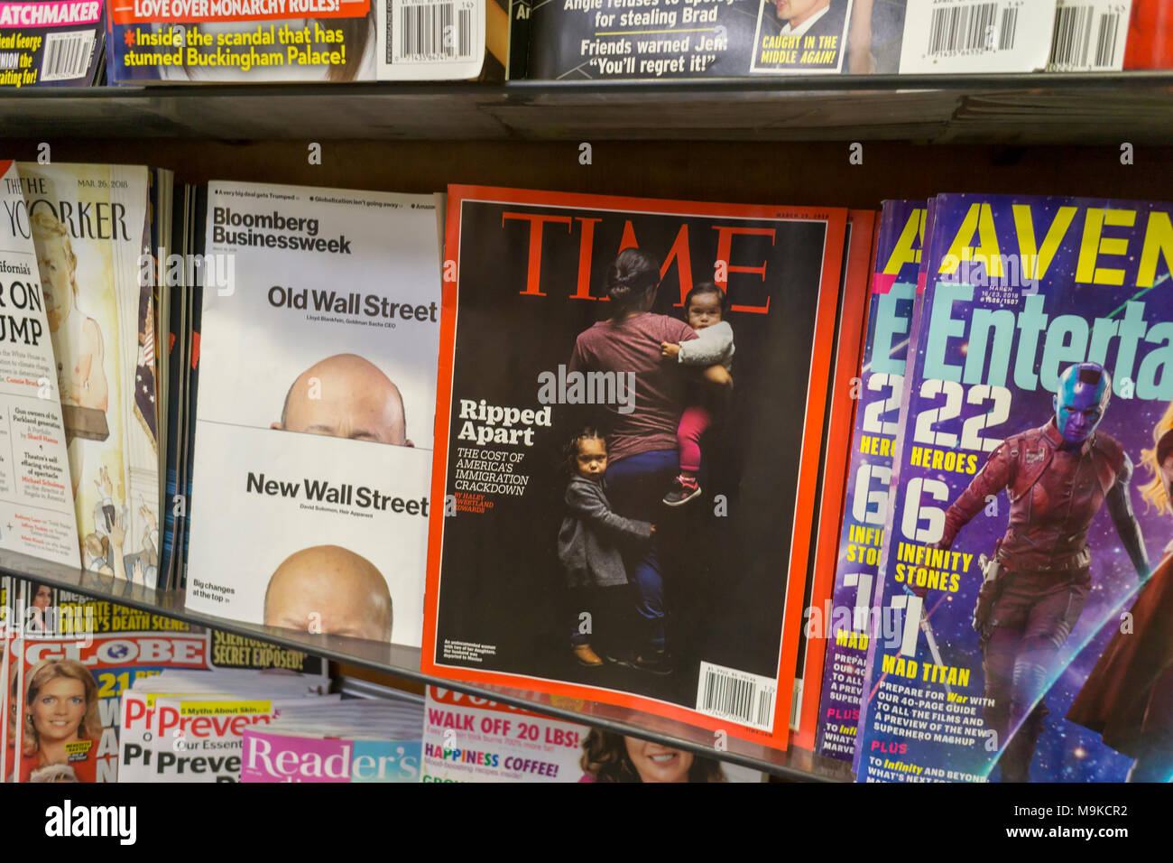 Time magazine is seen along with other periodicals on a newsstand in New York on Thursday, March 22, 2018. Meredith Corp., which purchased Time Inc. announced it is considering selling the non-lifestyle brands it picked up in the acquisition, including the flagship Time, Sports Illustrated, Money and Fortune. Meredith acquired Time in January 2018. (Â© Richard B. Levine) Stock Photo