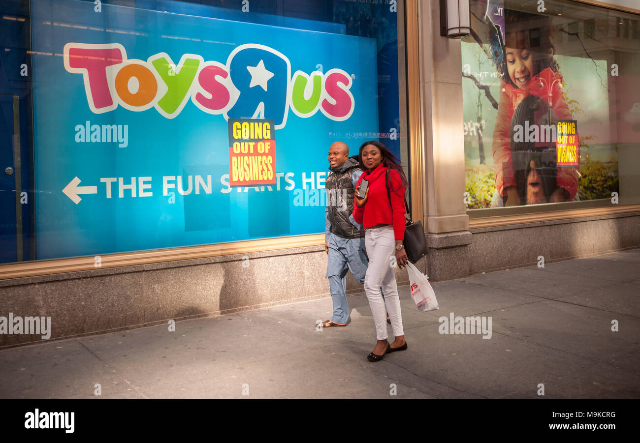 Signs posted on the window of the Toys R Us store in Times Square in New York on Friday,  March 23, 2018 announce that the store is closing and liquidation has begun. Toys R Us is liquidating and closing all 735 of its U.S. stores. The CEO of MGA Entertainment, Issac Larian, the maker of the Bratz dolls, announced a pledge of $200 million, and the creation of a GoFundMe campaign, to save approximately 400 of the 735 closing stores. (Â© Richard B. Levine) Stock Photo