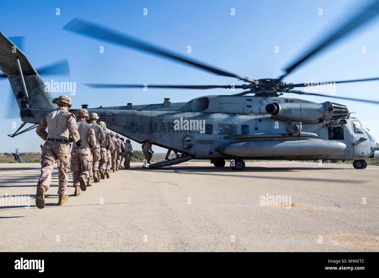 ISRAEL (March 12, 2018) U.S. Marines assigned to the Tactical Recovery of Aircraft Personnel (TRAP) team, 26th Marine Expeditionary Unit (MEU), board a CH-53E Super Stallion helicopter to begin fast-rope training, Israel, March 12, 2018. The 26th MEU is participating in exercise Juniper Cobra 2018 to strengthen relationships and capabilities with the Israeli Defense Force. (U.S. Marine Corps photo by Lance Cpl. Tojyea G. Matally/Released) Stock Photo