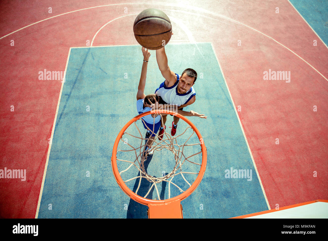 High angle view of basketball player dunking basketball in hoop Stock Photo Alamy