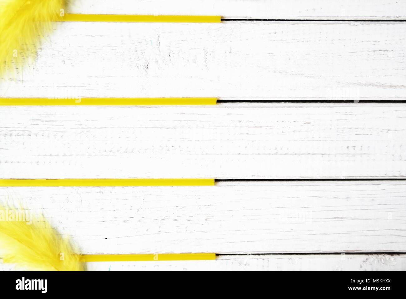 happy summer or spring concept with yellow color, white wooden background and text space Stock Photo