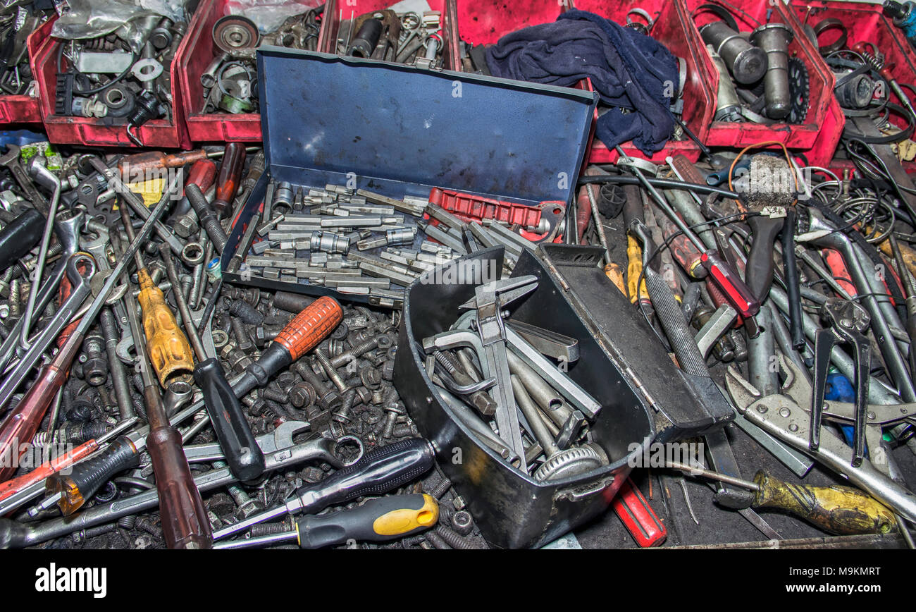 Bunch of messy hand tools in an auto mechanic garage Stock Photo