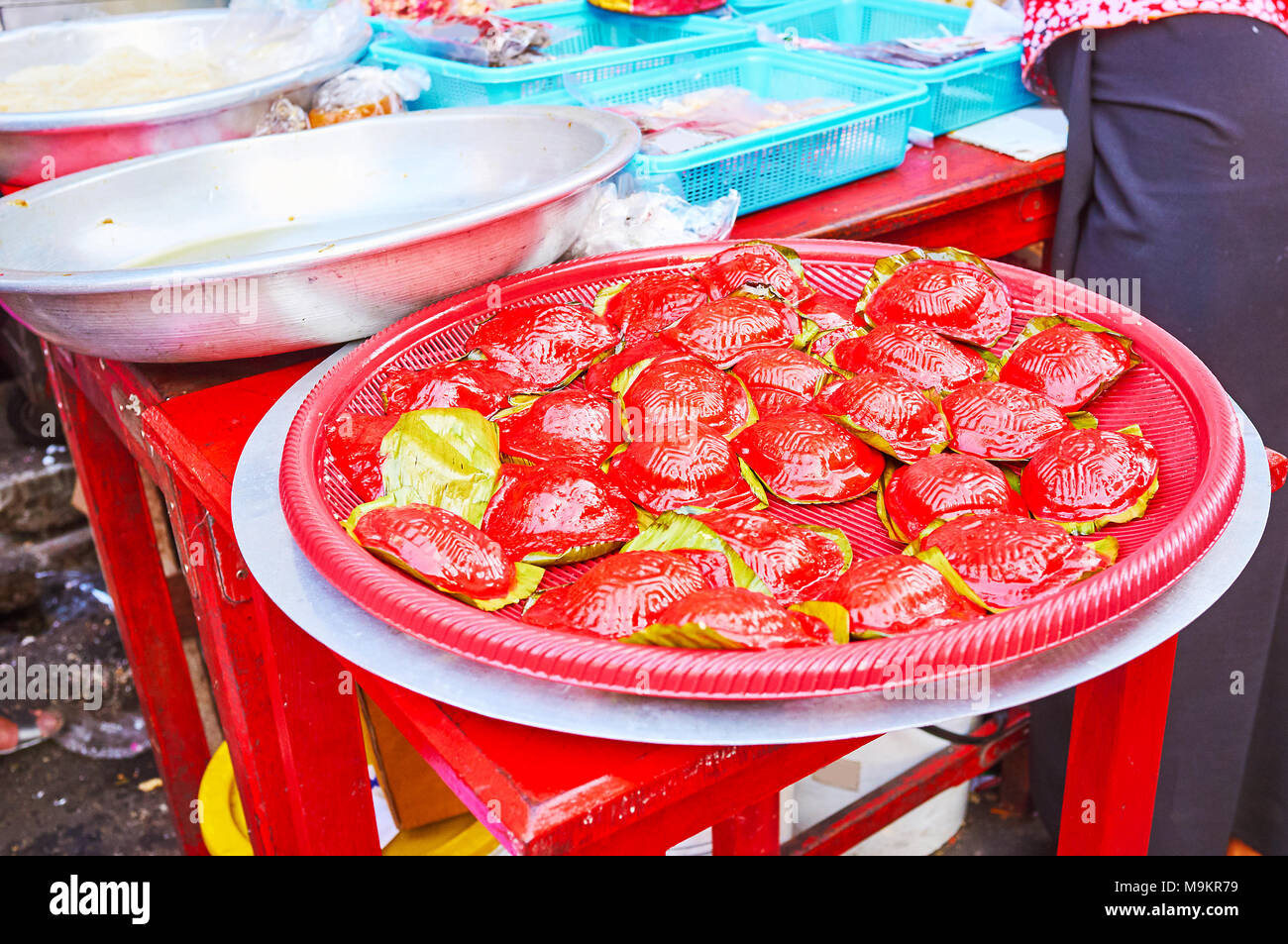 Nian gao sticky rise cakes are traditional Chinese New Year's desserts, popular in Yangon, Myanmar. Stock Photo