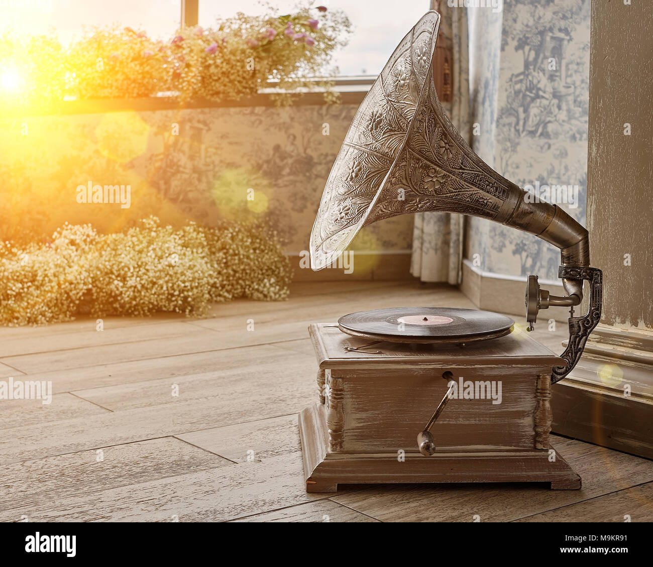 Beautiful silver vintage phonograph. Retro gramophone with copy space. Toned Stock Photo