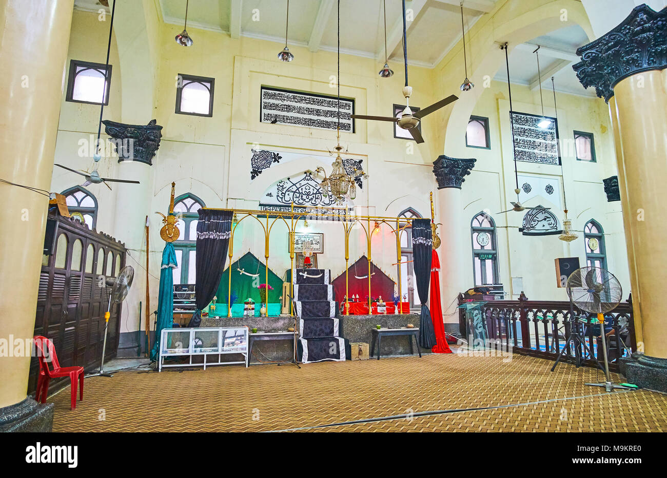 YANGON, MYANMAR - FEBRUARY 14, 2018: The prayer hall of Persian Mogul Shiah Masjid with a view on mihrab and minbar, on February 14 in Yangon. Stock Photo