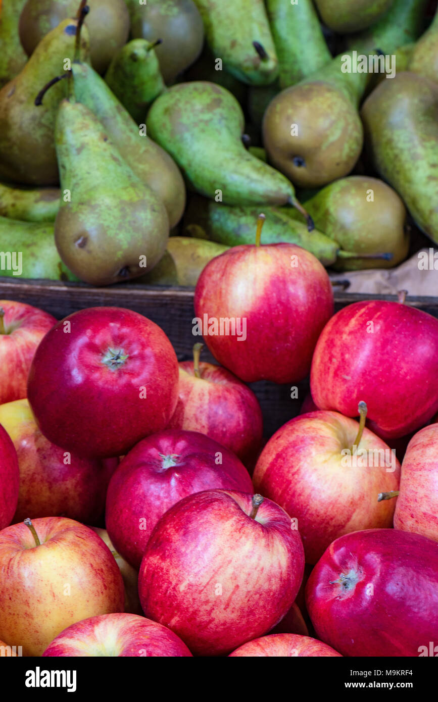 A selection of apples and pears Cockney rhyming slang for stairs on display at borough market in central london. Colourful fruit and vegetables stall. Stock Photo