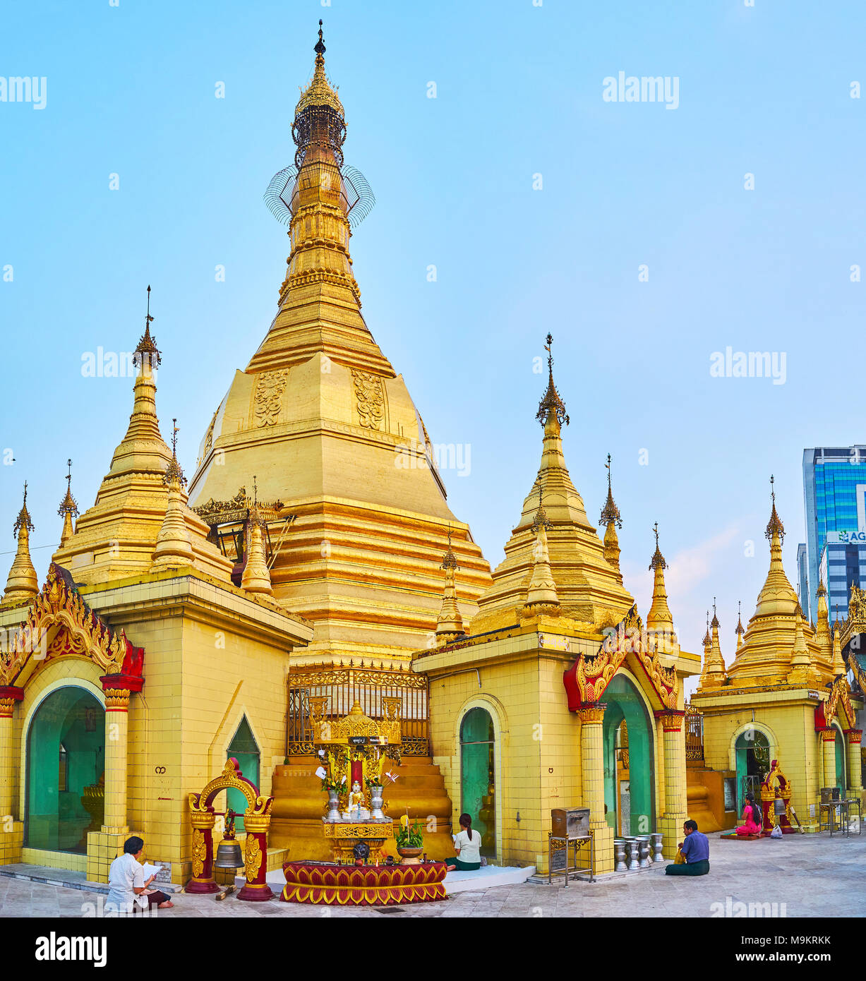 YANGON, MYANMAR - FEBRUARY 14, 2018: The golden Stupa of Sule Pagoda is topped with traditional hti decorative element - umbrella with relief patterns Stock Photo