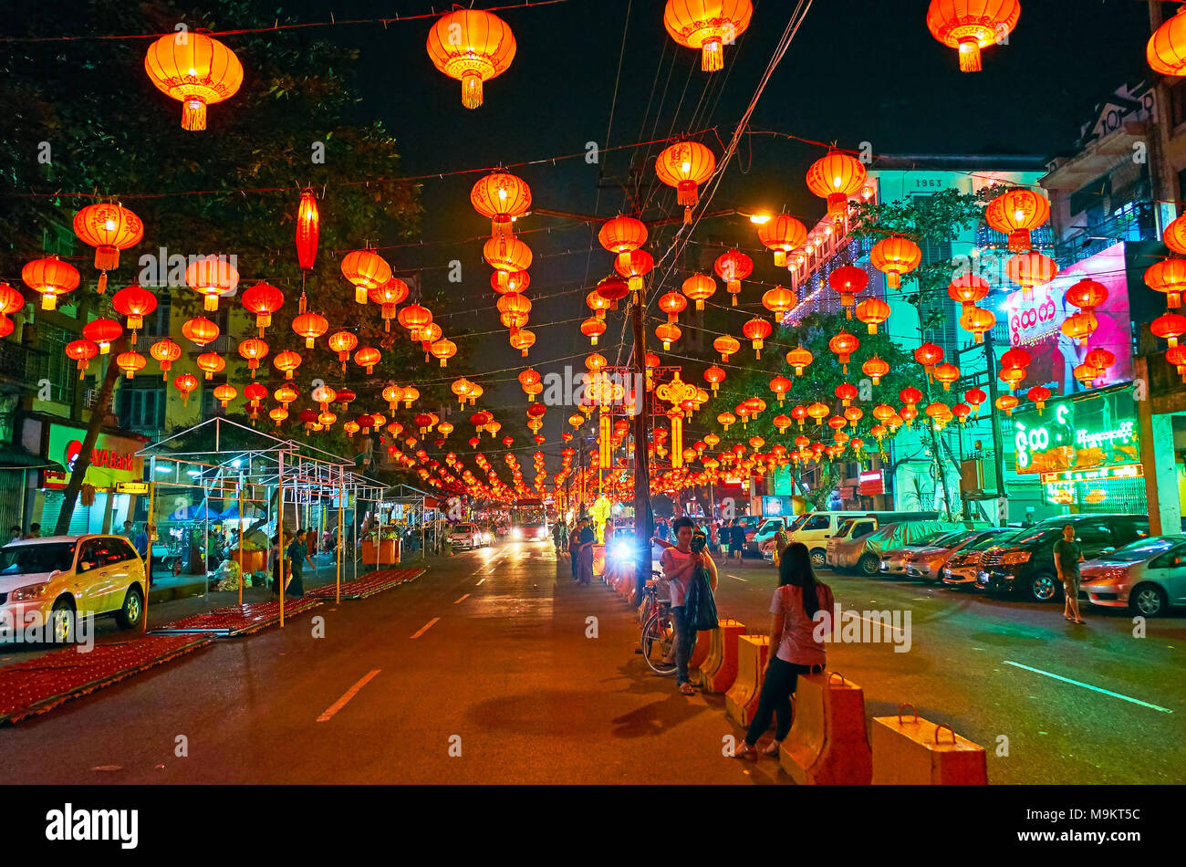 YANGON, MYANMAR - FEBRUARY 14, 2018: Spring Festival (Chinese New Year) with its brightly lighted decorations turns Chinatown into romantic place for  Stock Photo