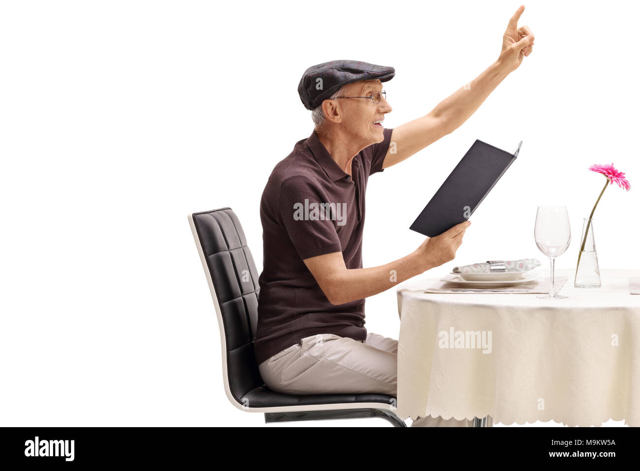 Senior sitting at a restaurant table and calling the waiter isolated on ...