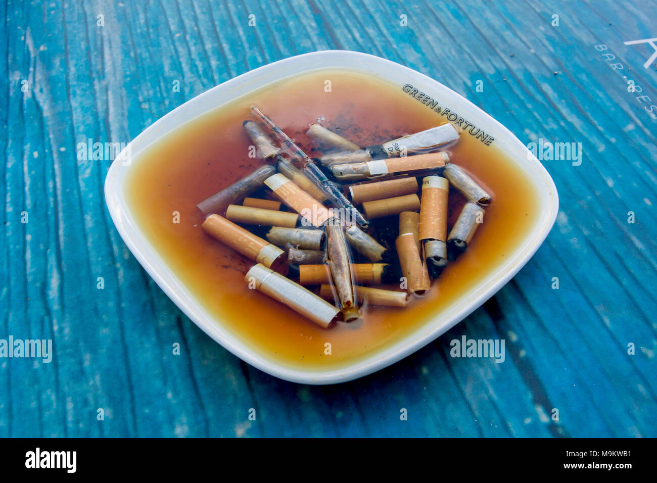 Cigarette soaked in water Stock Photo