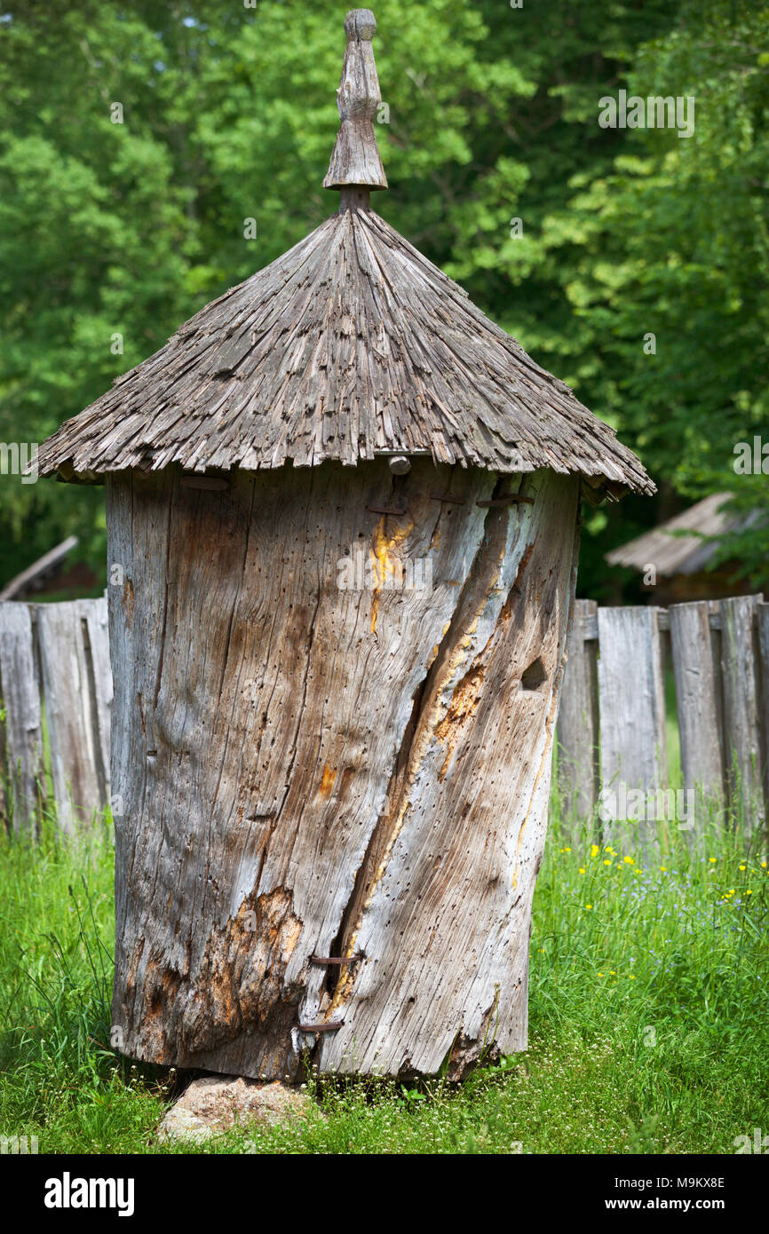 Ancient wooden beehive made from a tree trunk Stock Photo - Alamy