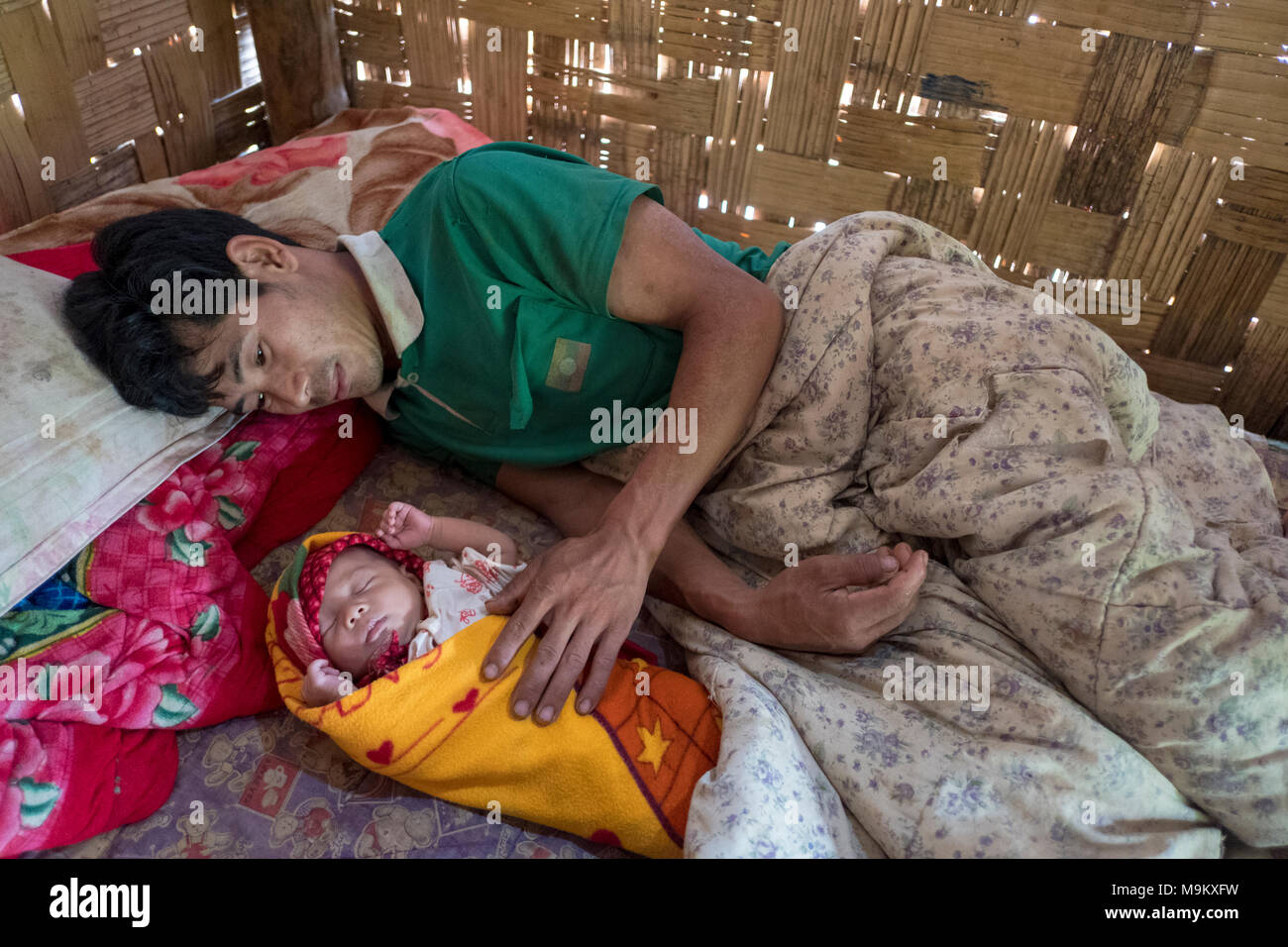 Jacinta Htu Son with his new born child Rita Son. Hai Kyawm, Lashio, Shan State, Myanmar. Stock Photo