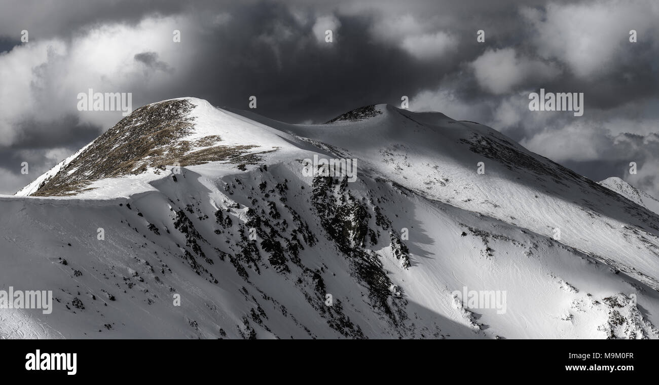 Dramatic winter storm clouds over Peak 4 at Breckenridge in the Rocky Mountains, Colorado Stock Photo